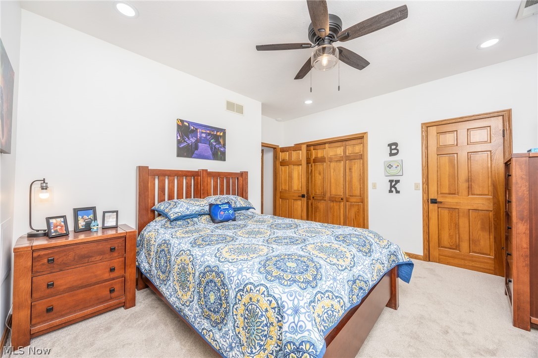 1602 Glendale Road, Unit 3 Marietta, OH 45750 - Photo 27 of 49 Carpeted room featuring a ceiling fan, recessed lighting, and warm-toned paneled doors