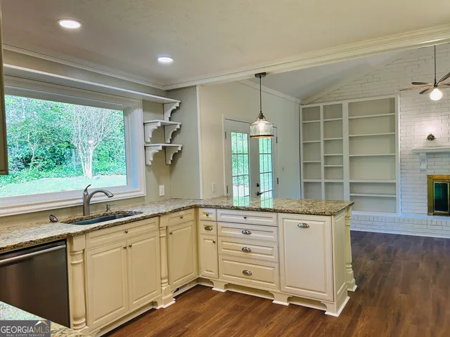 a view of kitchen with wooden floor and window