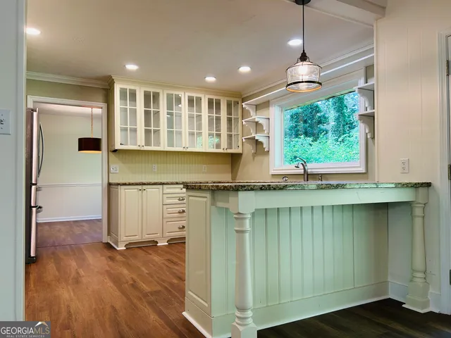 a kitchen with appliances and cabinets