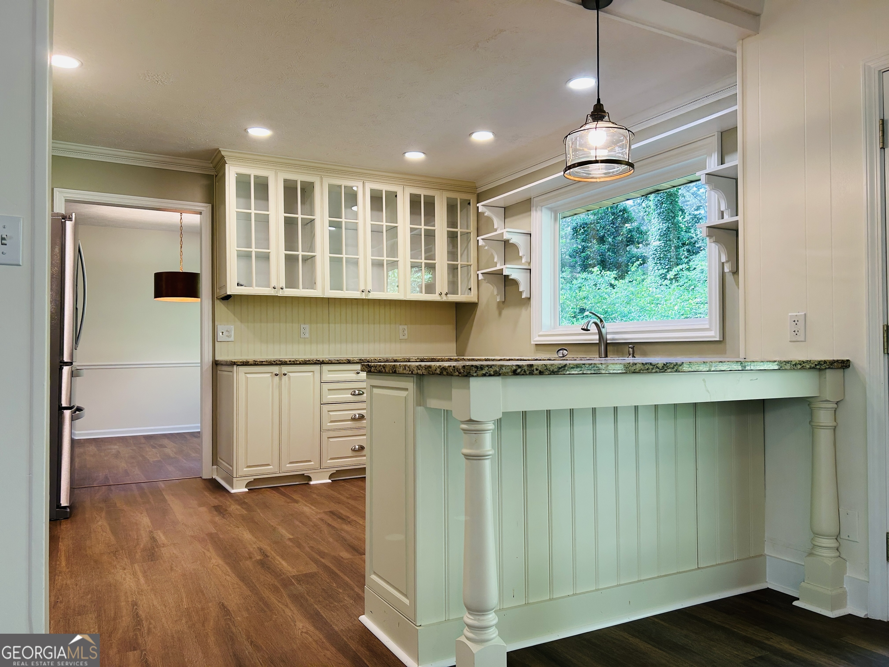 2131 Perrin Drive Lawrenceville, GA 30043 - Photo 17 of 60 a view of kitchen with wooden floor and window