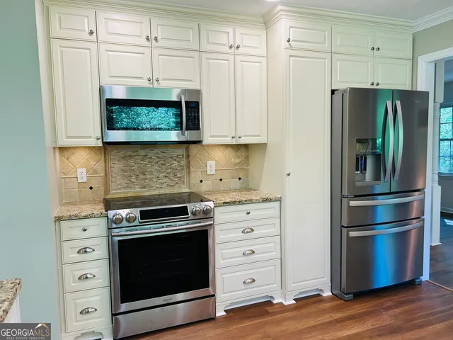 a kitchen with granite countertop a window and a sink