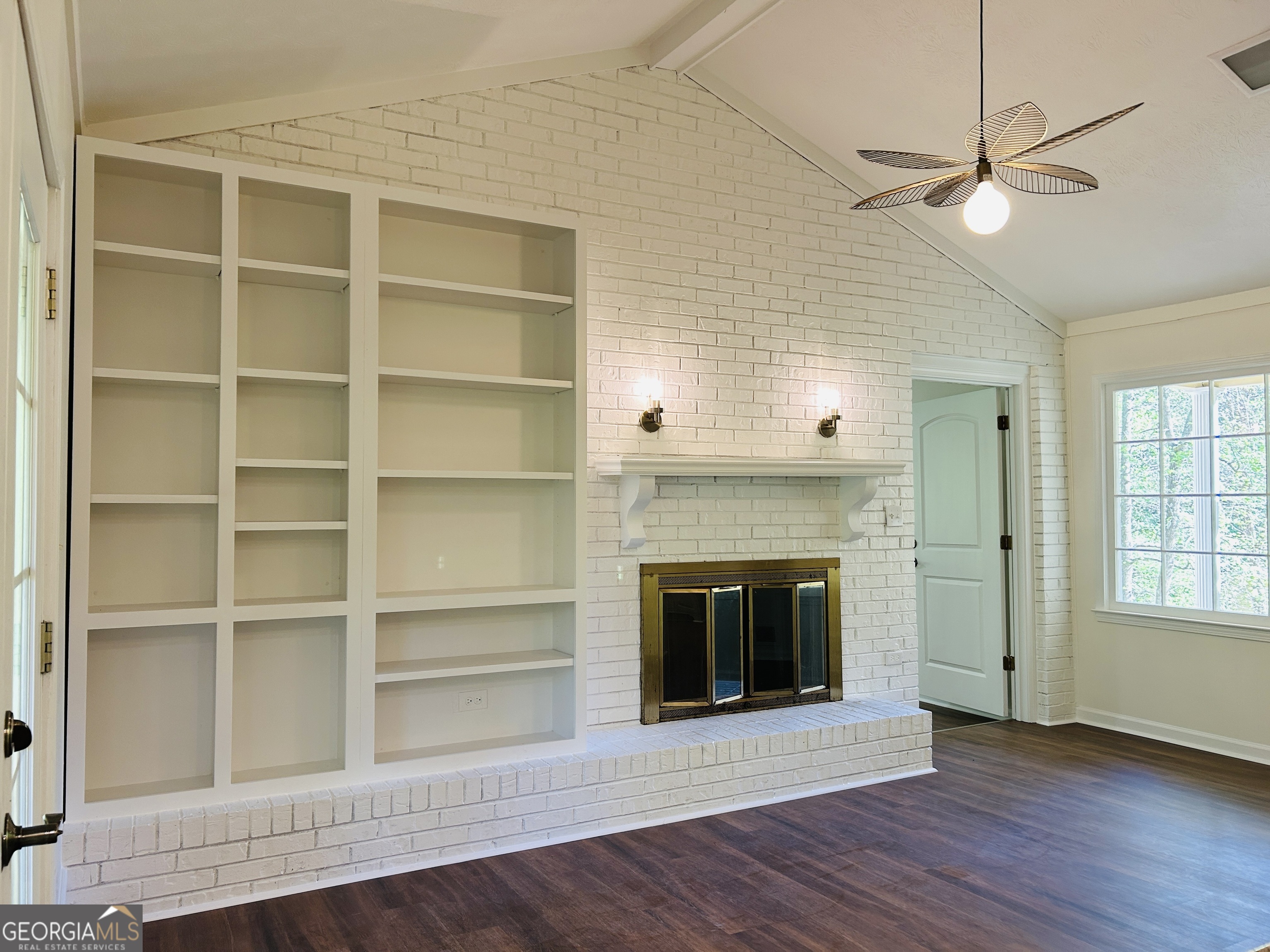 2131 Perrin Drive Lawrenceville, GA 30043 - Photo 24 of 60 a view of an empty room with a fireplace and a window
