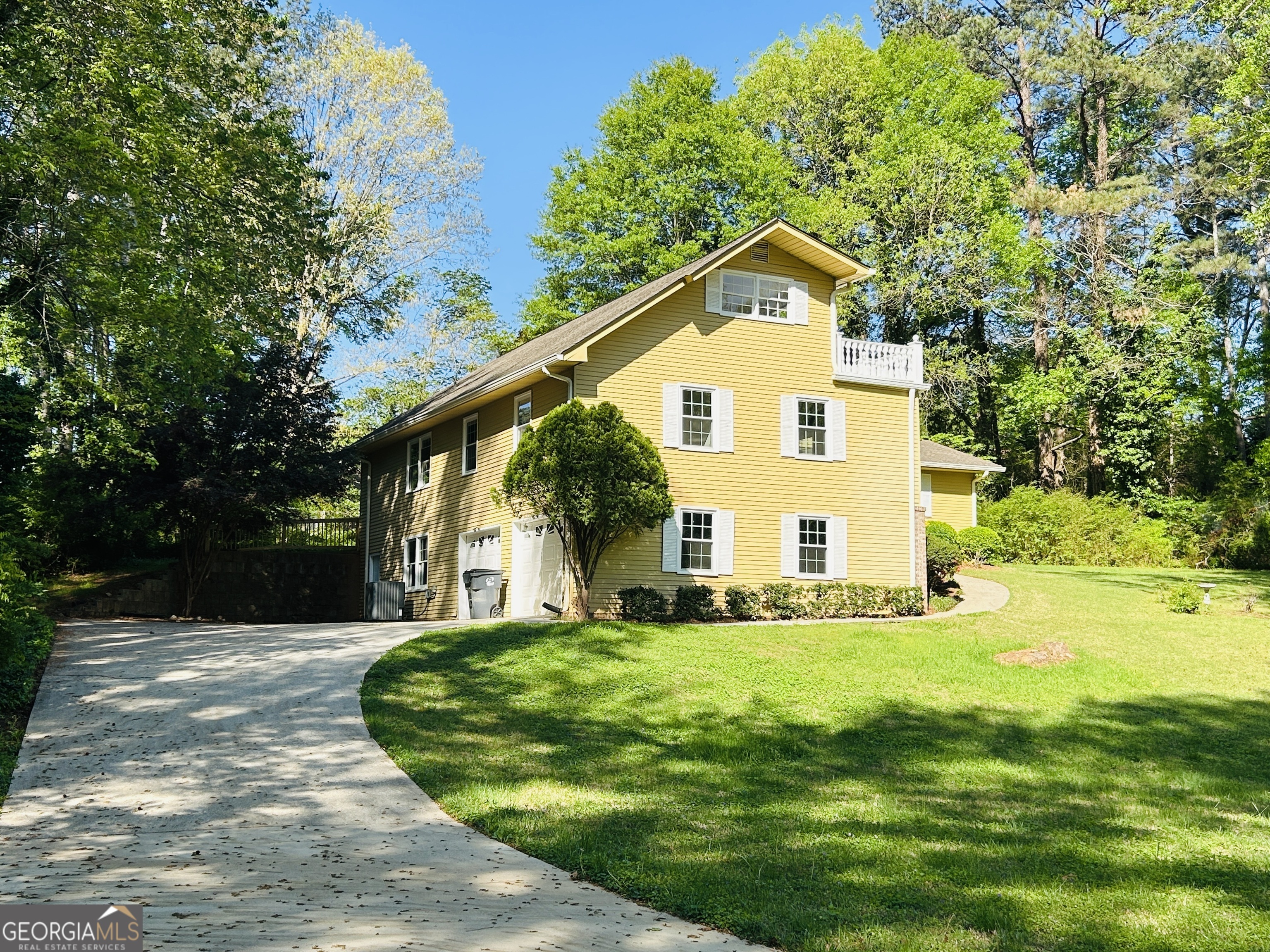 2131 Perrin Drive Lawrenceville, GA 30043 - Photo 3 of 60 a front view of a house with a yard