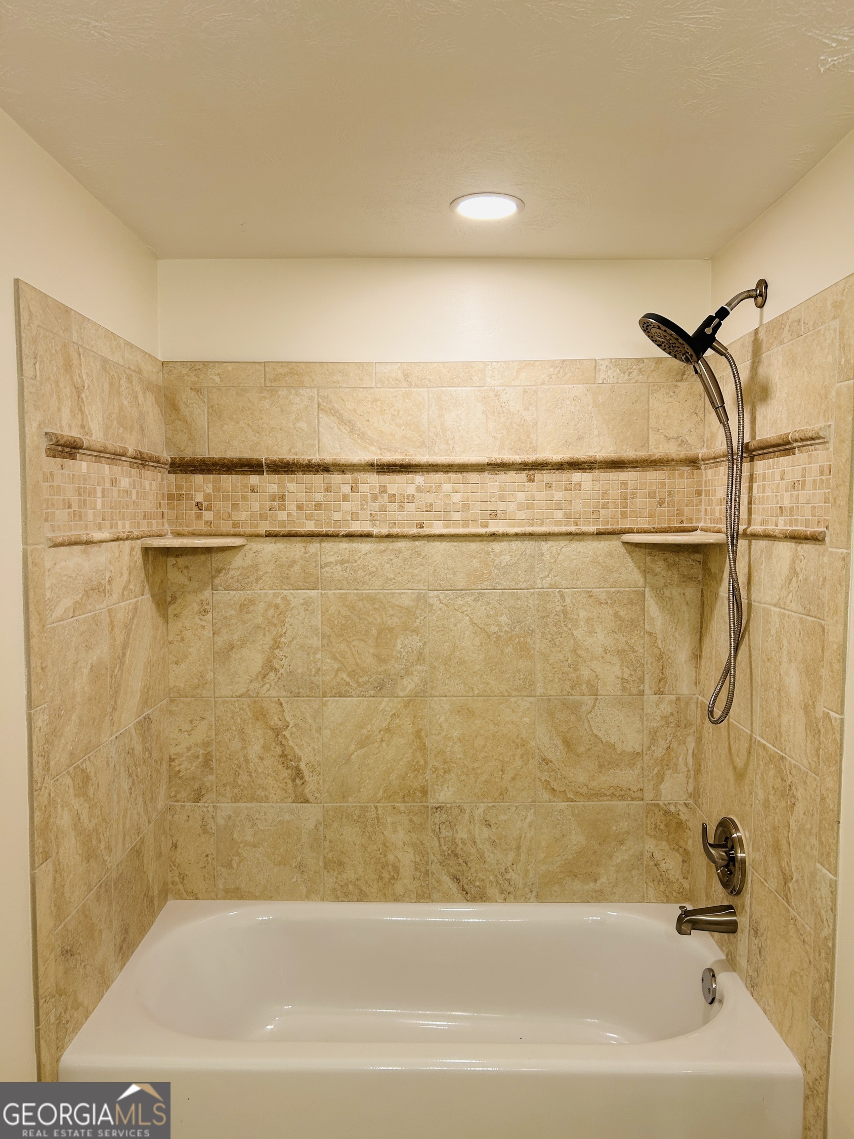 2131 Perrin Drive Lawrenceville, GA 30043 - Photo 36 of 60 a bathroom with a shower and a bath tub