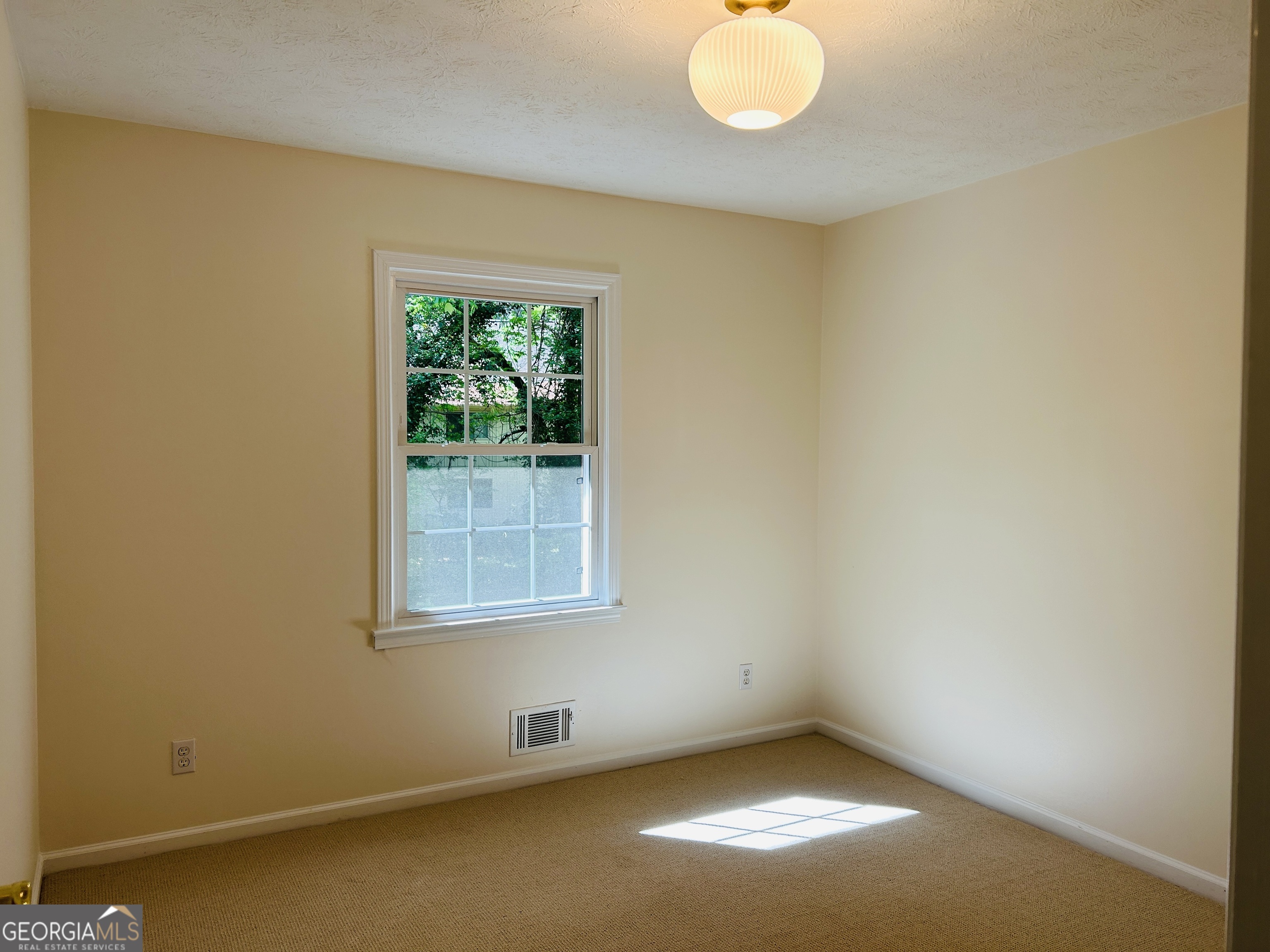 2131 Perrin Drive Lawrenceville, GA 30043 - Photo 37 of 60 an empty room with a window