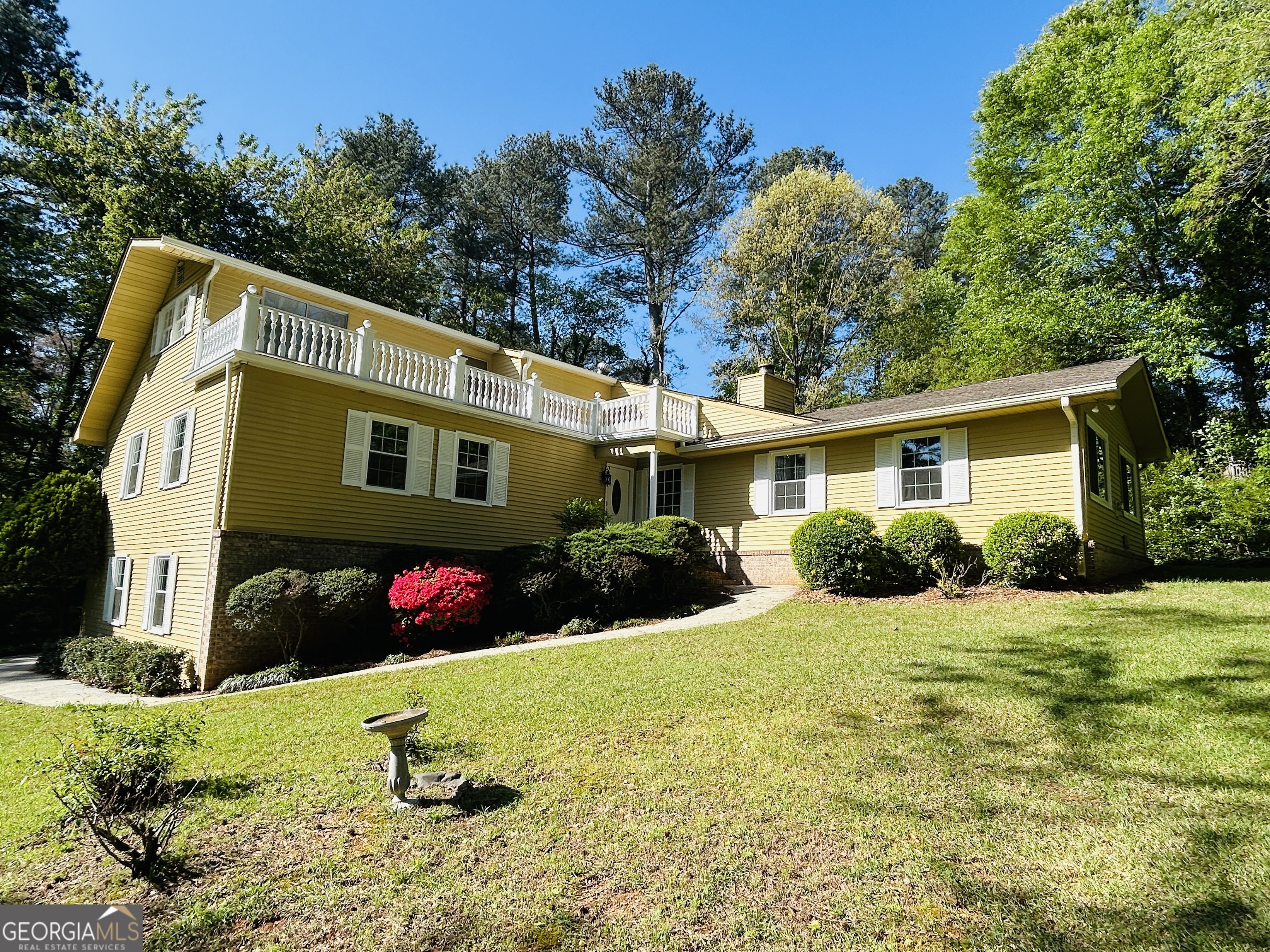 2131 Perrin Drive Lawrenceville, GA 30043 - Photo 5 of 60 a front view of a house with a yard
