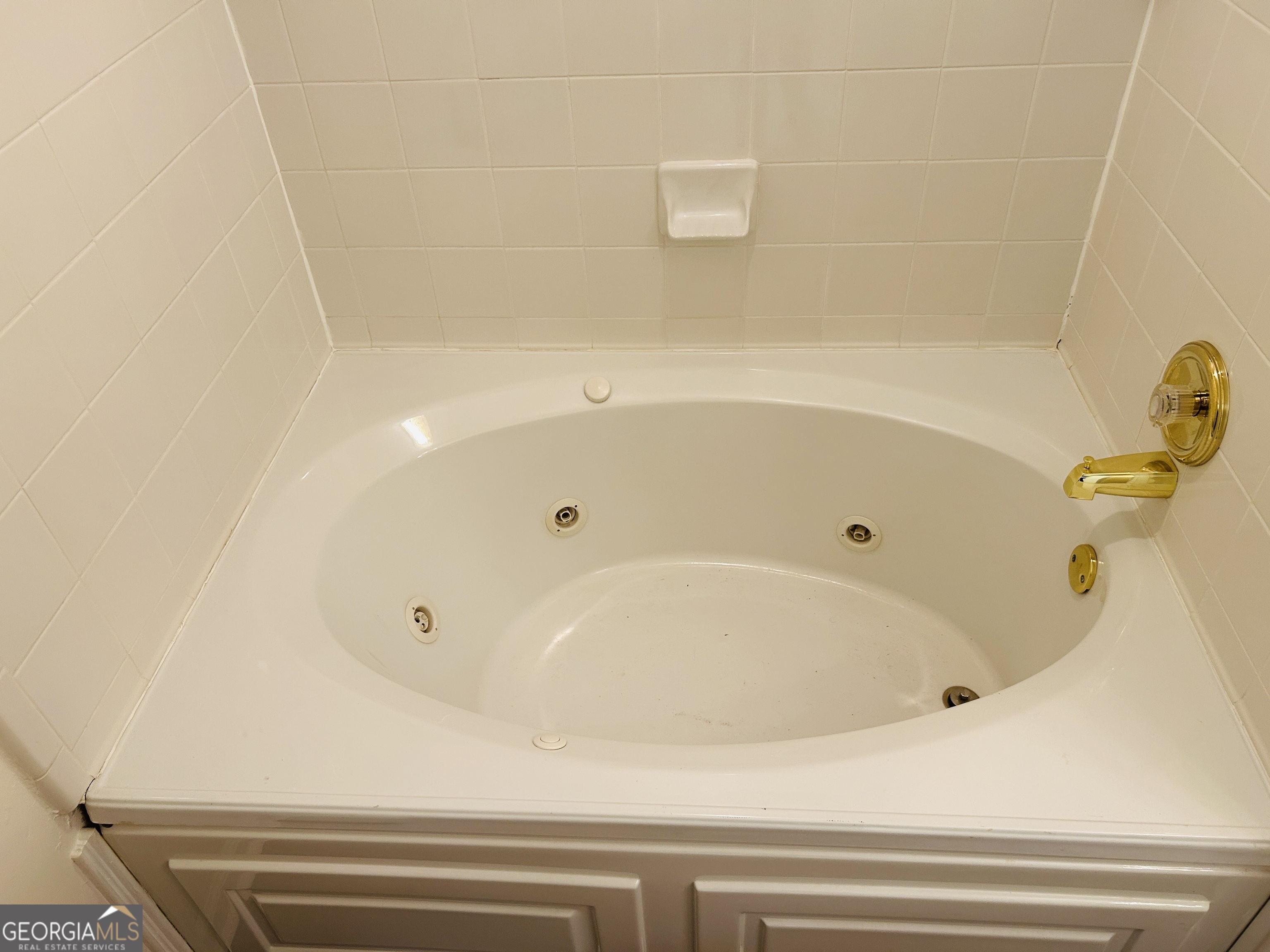 2131 Perrin Drive Lawrenceville, GA 30043 - Photo 52 of 60 a bathroom with a tub