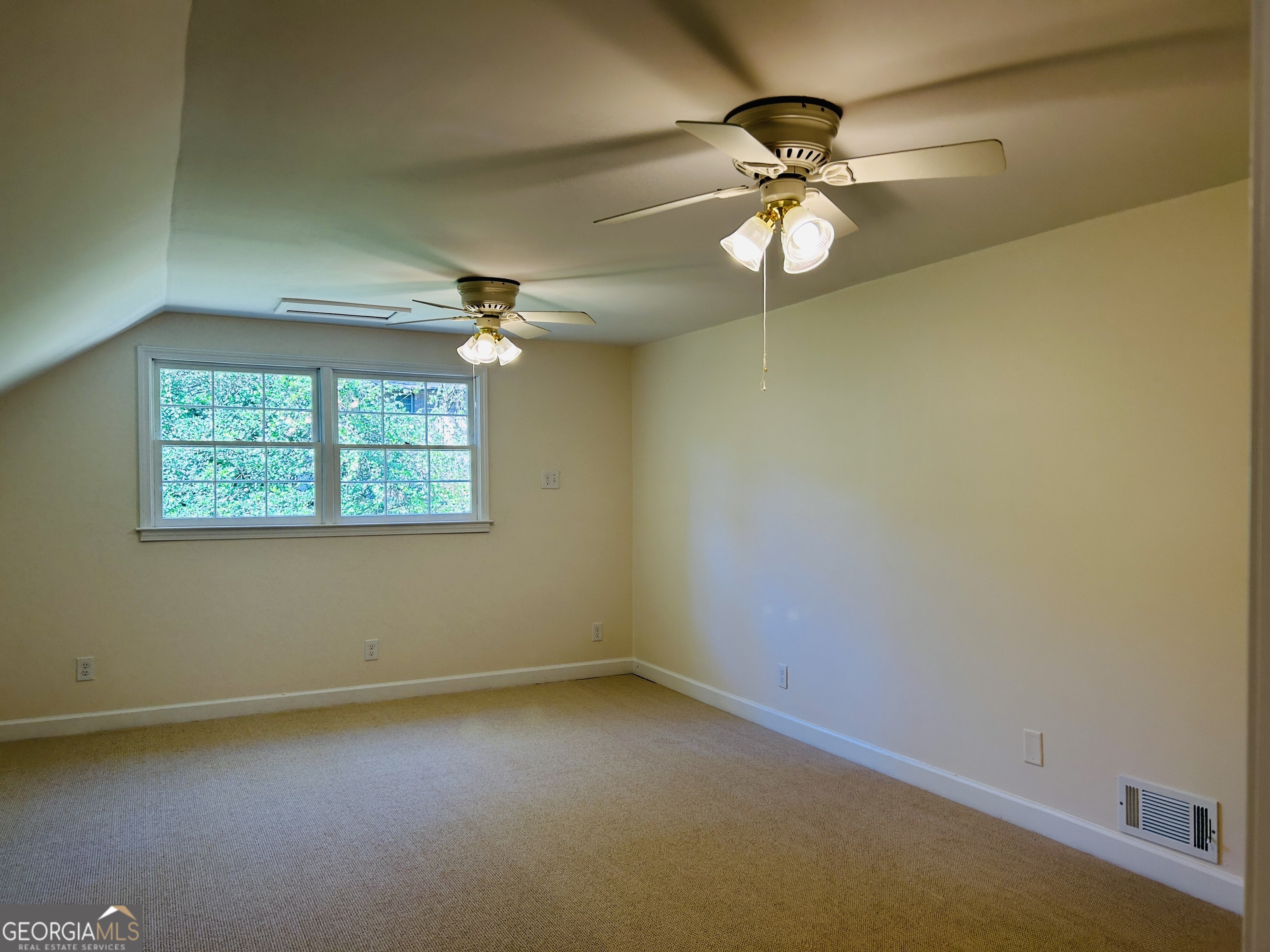2131 Perrin Drive Lawrenceville, GA 30043 - Photo 53 of 60 an empty room with a window and a fan