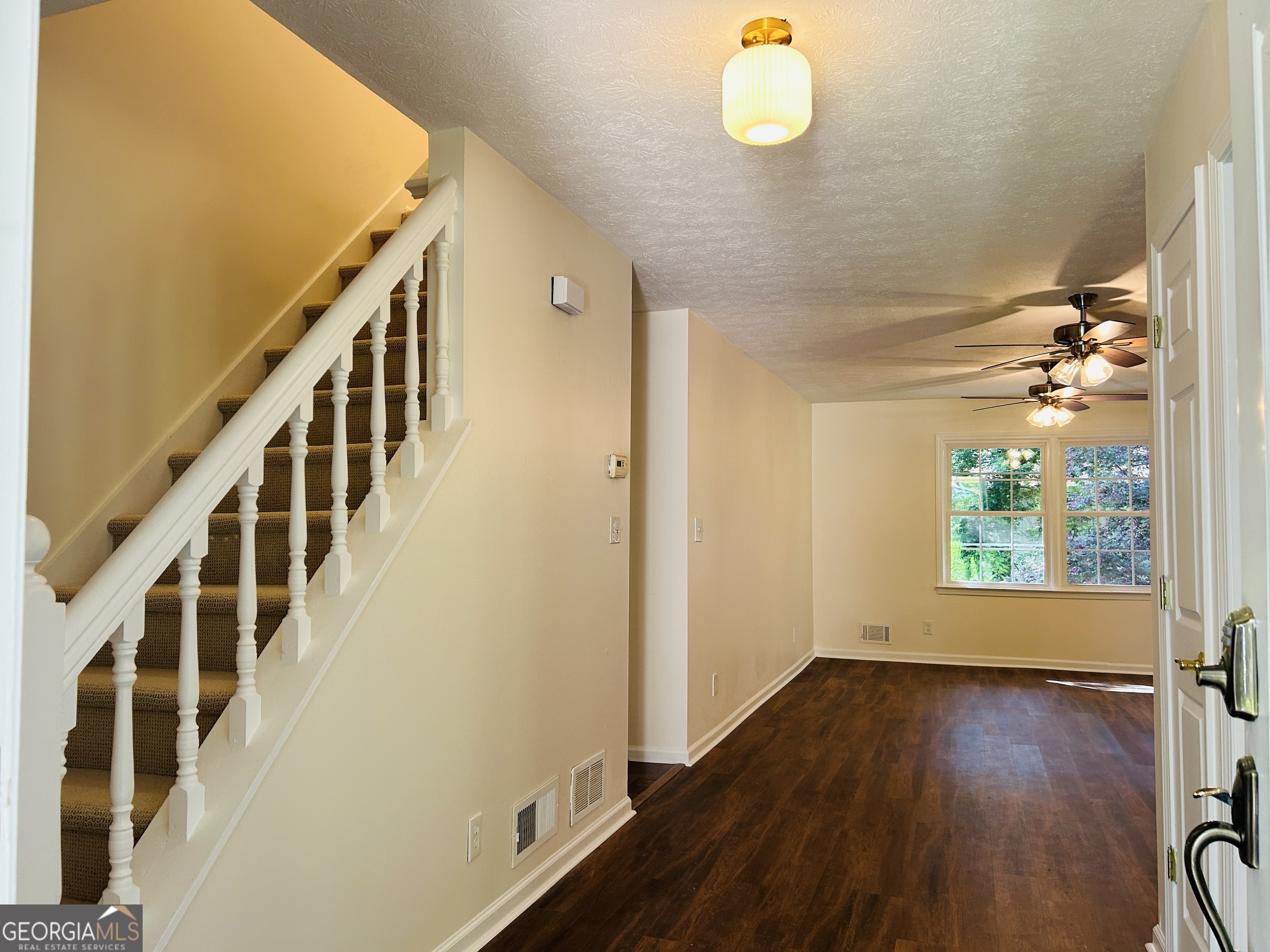 2131 Perrin Drive Lawrenceville, GA 30043 - Photo 7 of 60 a view of an entryway with wooden floor