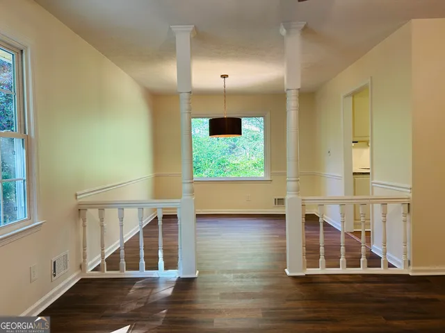 a view of entryway with wooden floor