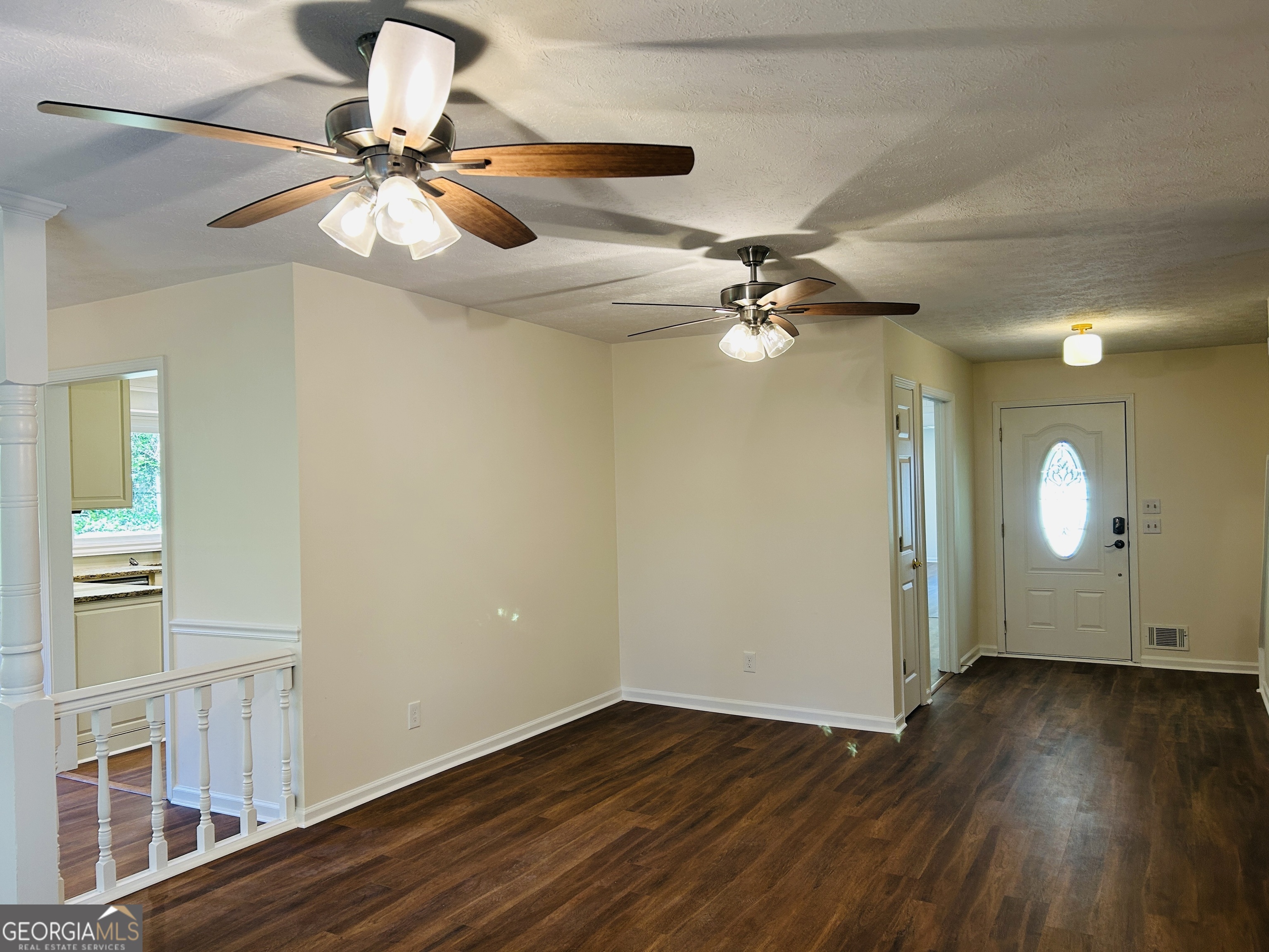 2131 Perrin Drive Lawrenceville, GA 30043 - Photo 10 of 60 a view of a room with wooden floor fan and windows