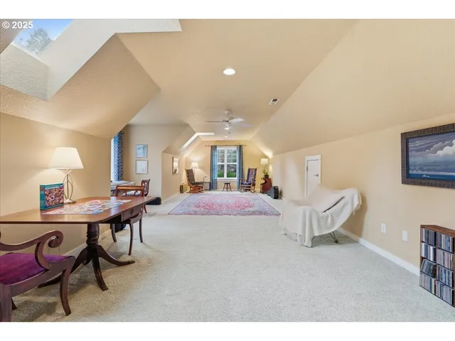 a living room with furniture a lamp and a window