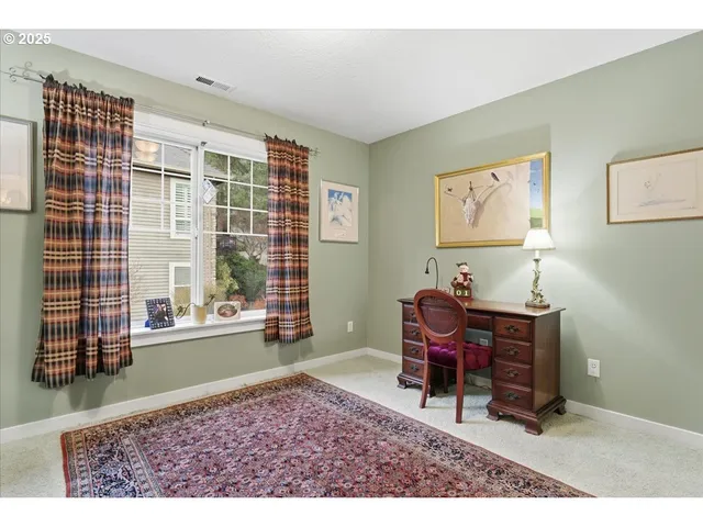 a balcony with table and chairs