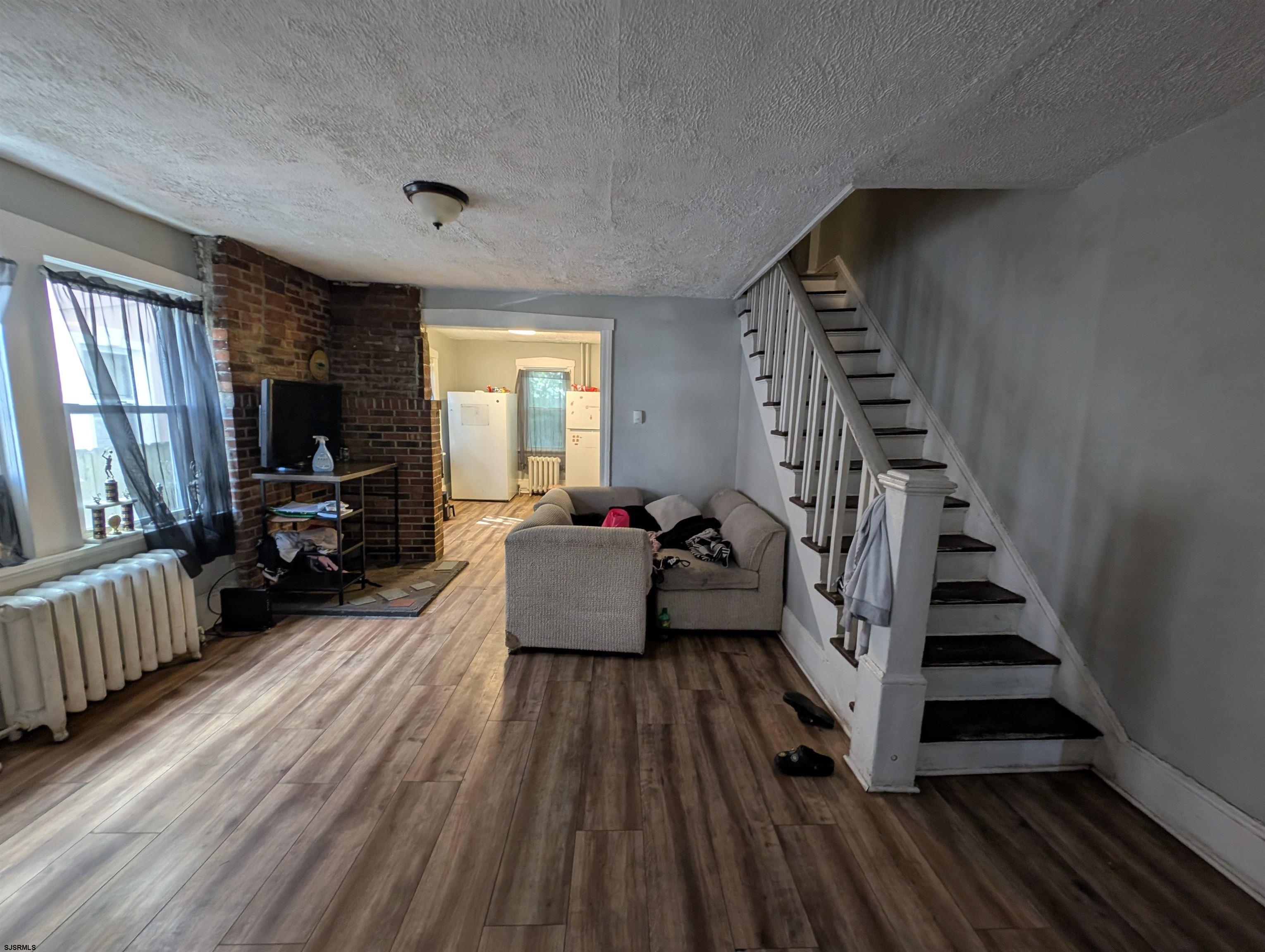 237 Guard Place Pleasantville, NJ 08232 - Photo 3 of 16 a living room with furniture and a wooden floor