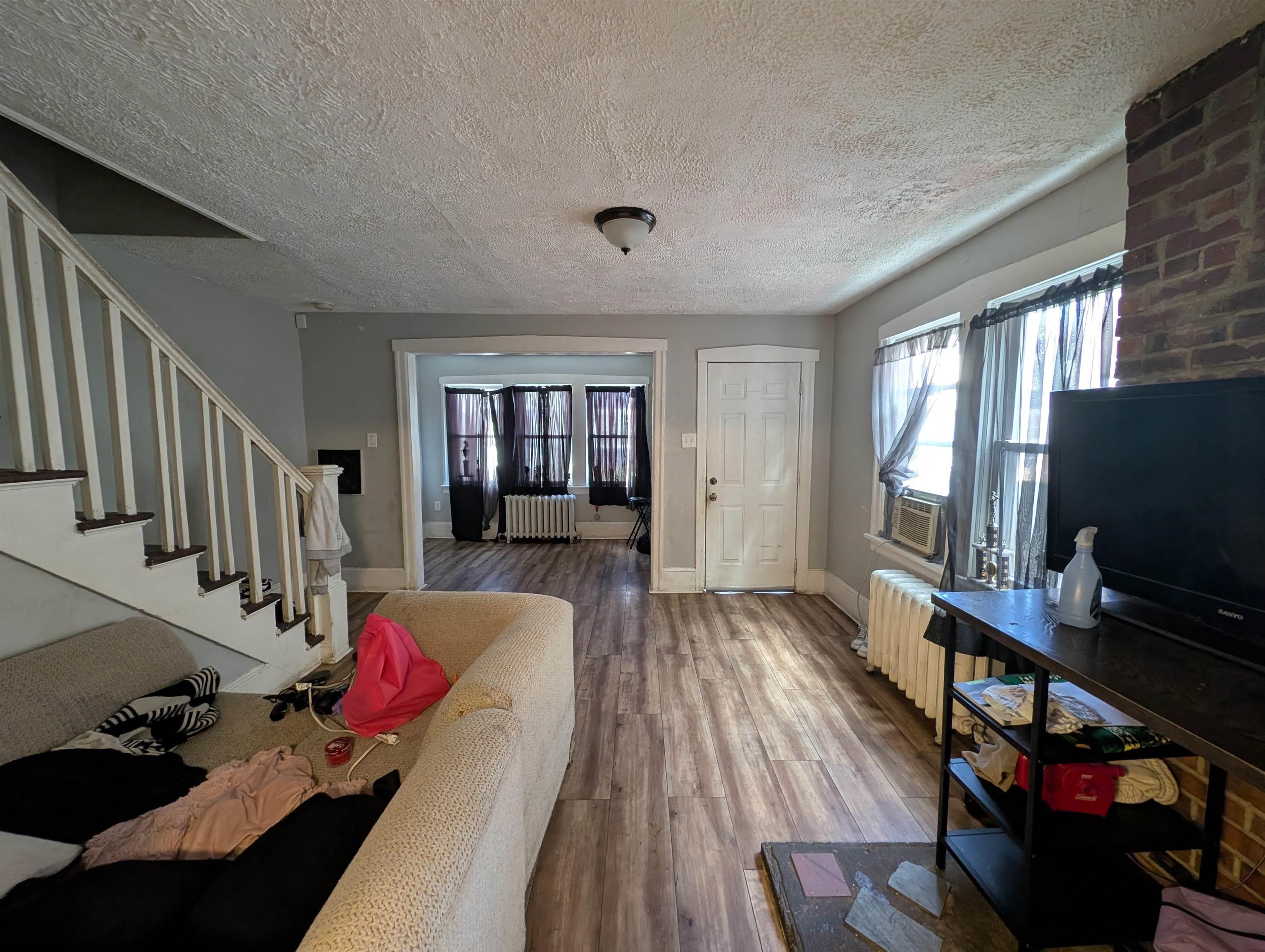 237 Guard Place Pleasantville, NJ 08232 - Photo 4 of 16 a living room with furniture and a flat screen tv