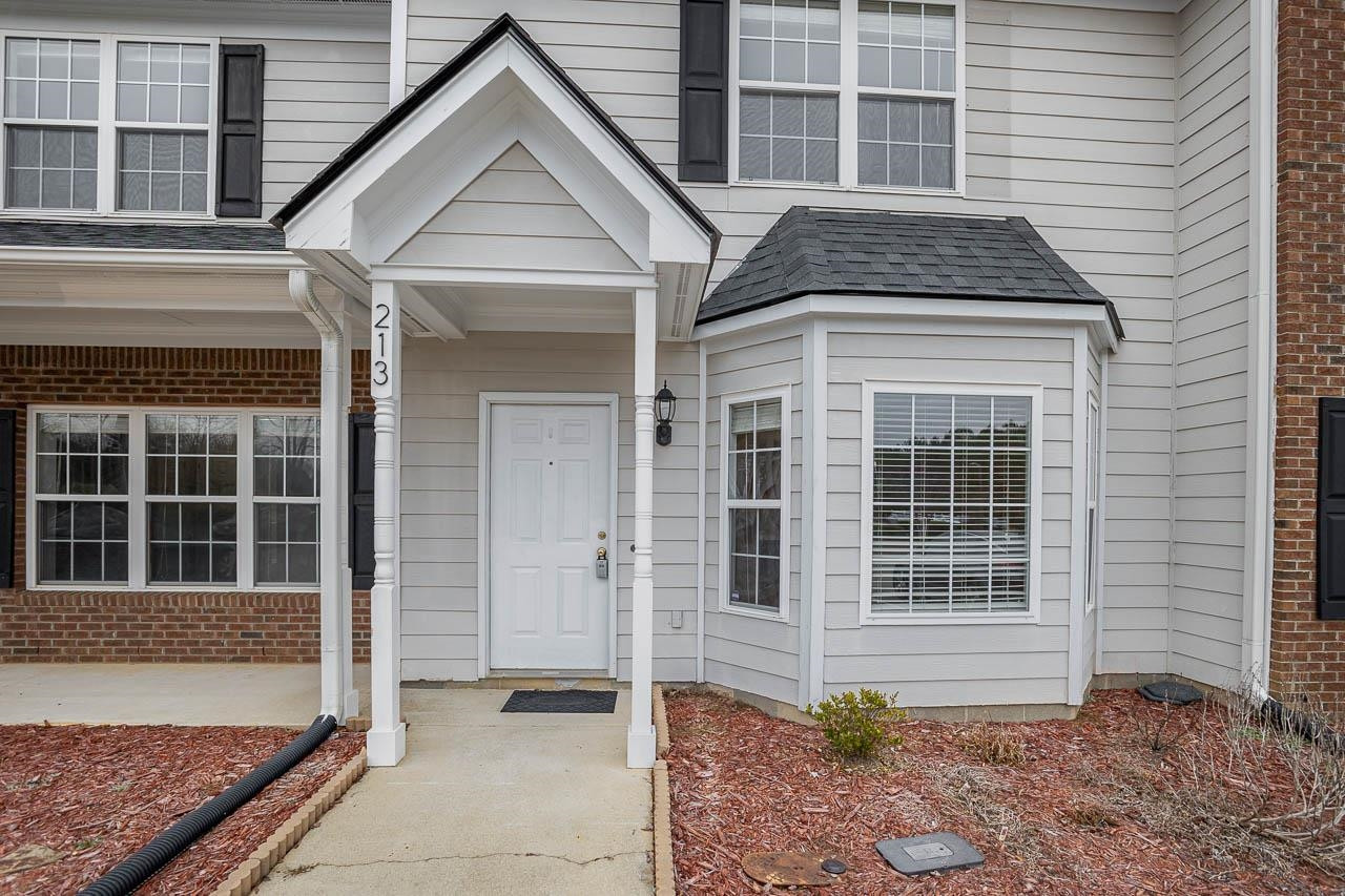213 Dairy Road Clayton, NC 27520 - Photo 1 of 31 a front view of a house with a yard