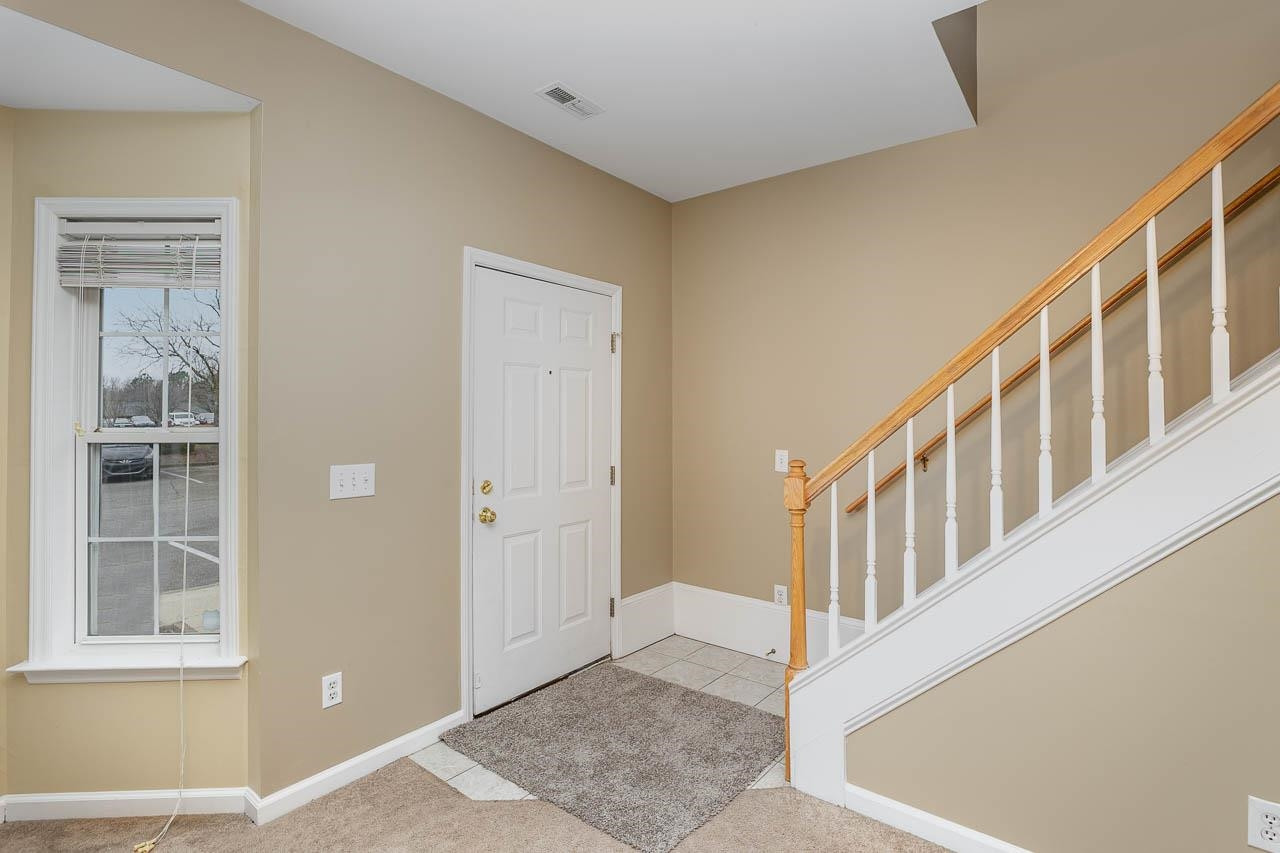 213 Dairy Road Clayton, NC 27520 - Photo 11 of 31 a view of an entryway with staircase