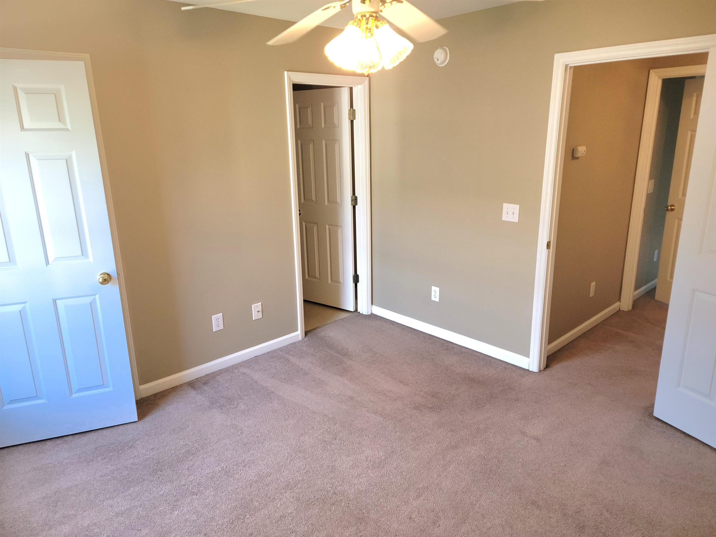 213 Dairy Road Clayton, NC 27520 - Photo 21 of 31 an empty room with windows and entrance
