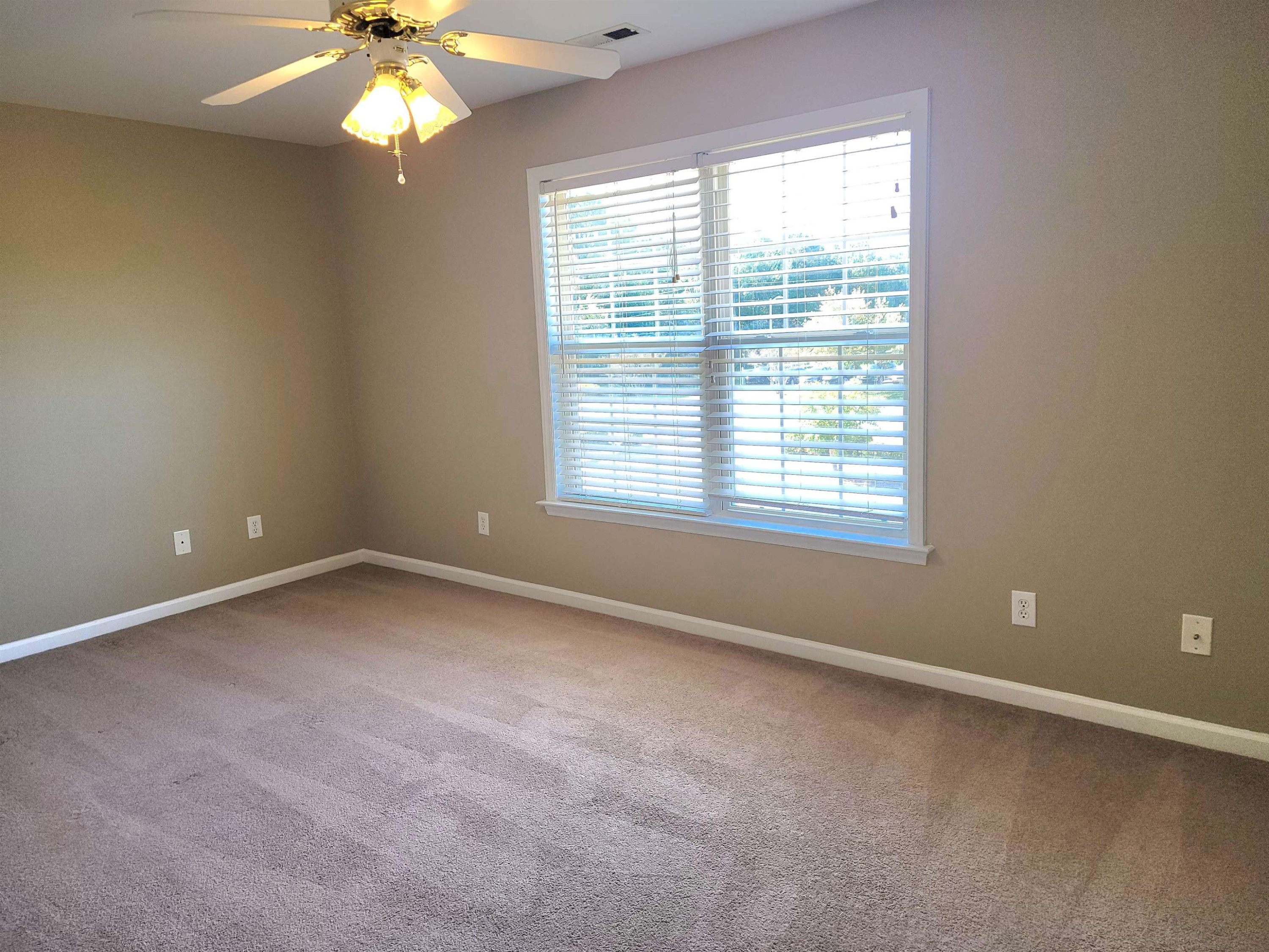 213 Dairy Road Clayton, NC 27520 - Photo 23 of 31 a view of an empty room with a window