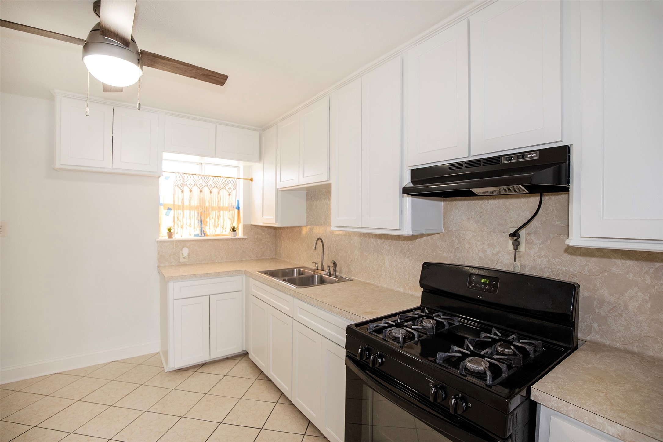 The kitchen features a gas stove that is sure to please any cook.