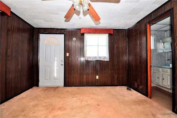 a view of an entryway with a door
