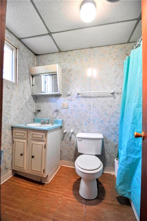 2014 5th Street Cardale, PA 15420 - Photo 13 of 32 a bathroom with a granite countertop toilet a sink and a mirror