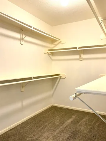 a view of a room with racks on the wall