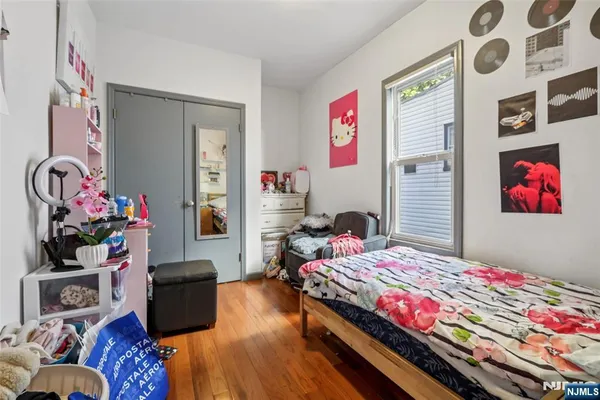 a bedroom with bed and a couch