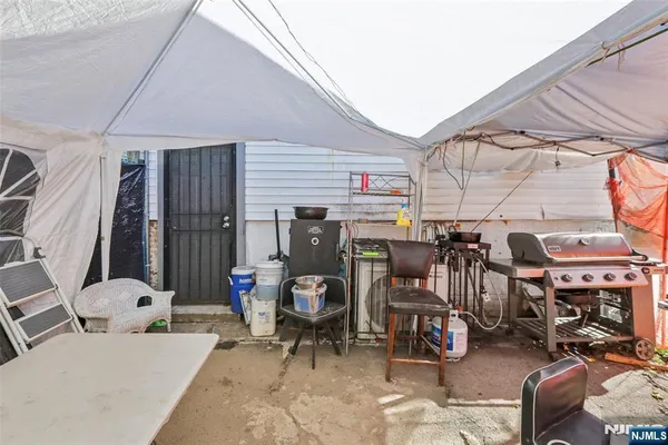 a view of a garage with a table and chairs