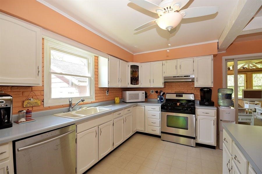 1470 Waverly Road Porter, IN 46304 - Photo 3 of 10 a kitchen with stainless steel appliances a stove sink microwave and cabinets