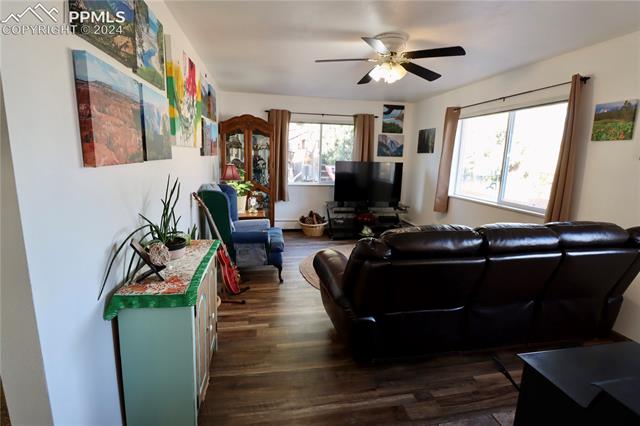 7 Bluff Road Florence, CO 81226 - Photo 14 of 29 Living room with ceiling fan and dark wood-type flooring