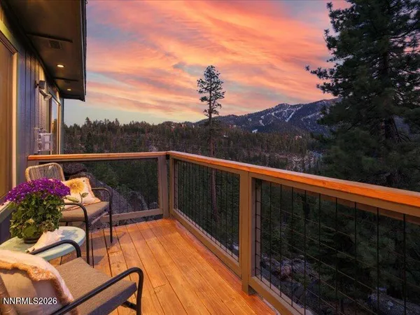 a view of a balcony with chairs