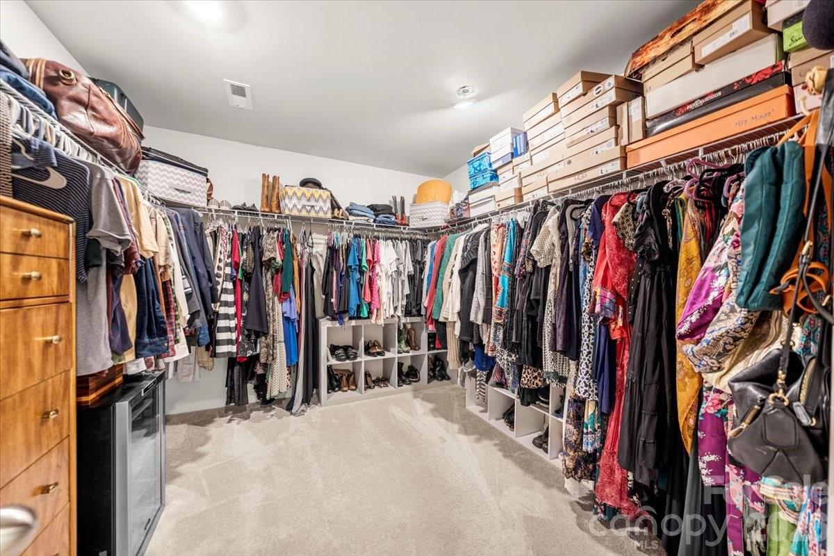 134 Dry Rivers Lane Mooresville, NC 28117 - Photo 17 of 29 a view of walk in closet with clothes
