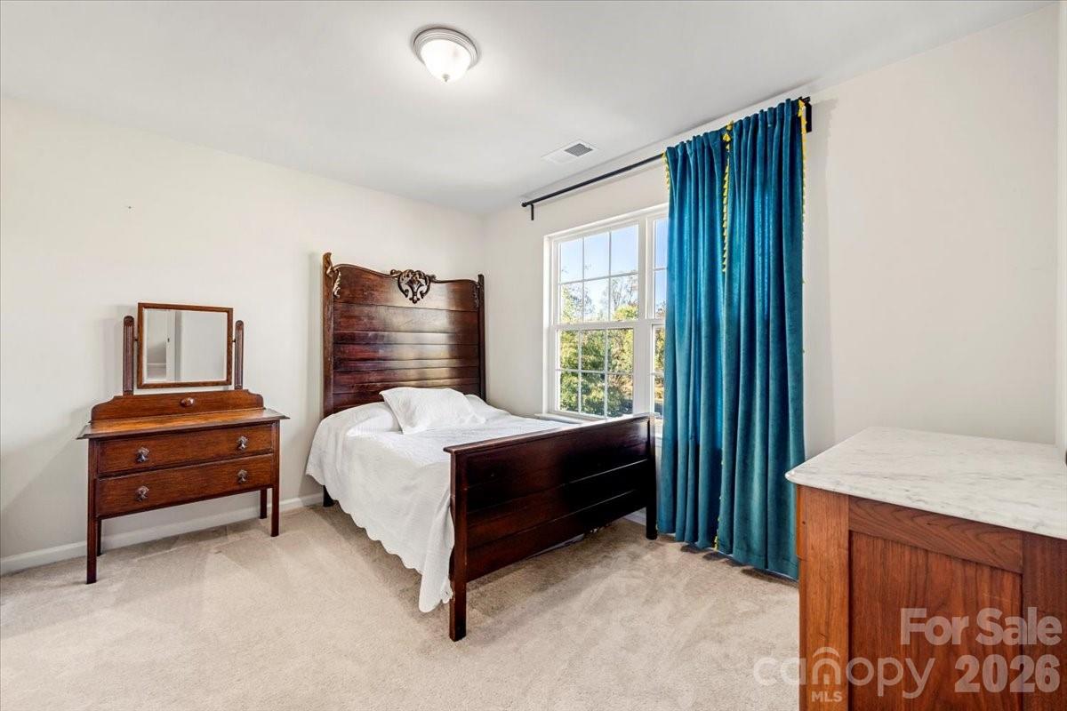 134 Dry Rivers Lane Mooresville, NC 28117 - Photo 20 of 29 a bedroom with a bed and a window