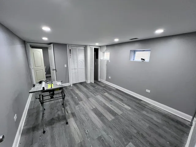 a view of room with furniture and wooden floor