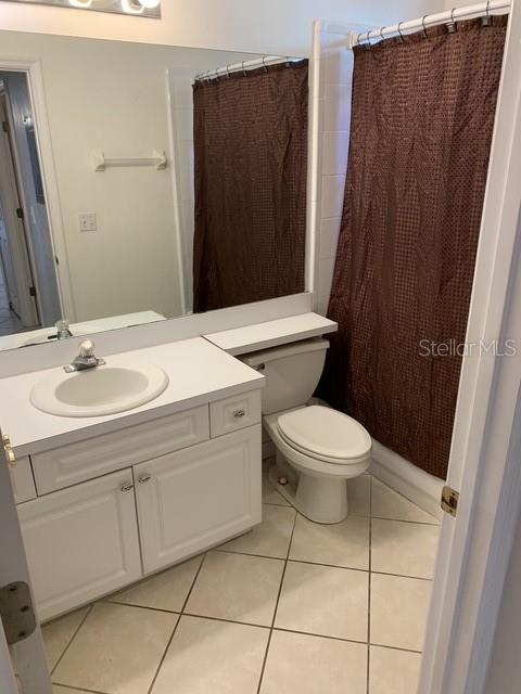 350 Northwest 50th Boulevard, Unit 350 Gainesville, FL 32607 - Photo 15 of 16 a bathroom with a toilet sink and a mirror