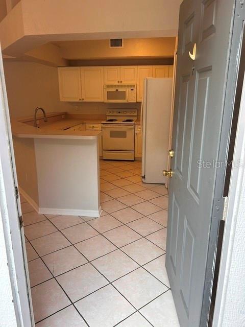 350 Northwest 50th Boulevard, Unit 350 Gainesville, FL 32607 - Photo 3 of 16 a kitchen with a stove and a refrigerator