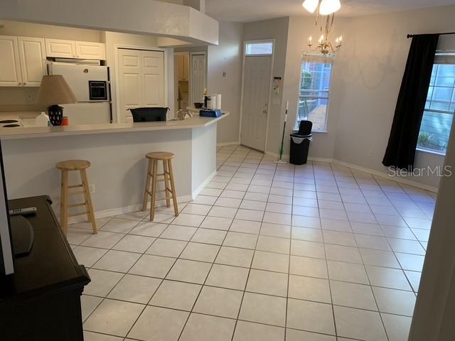 350 Northwest 50th Boulevard, Unit 350 Gainesville, FL 32607 - Photo 5 of 16 a room with a washing machine and a a sink