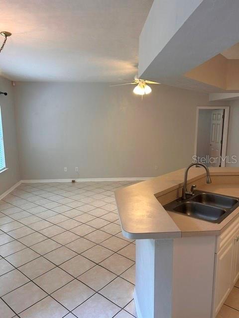 350 Northwest 50th Boulevard, Unit 350 Gainesville, FL 32607 - Photo 6 of 16 a kitchen with a sink and chandelier