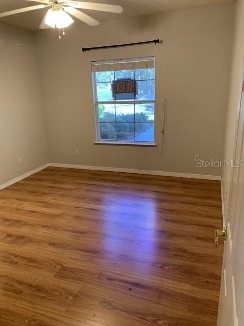 350 Northwest 50th Boulevard, Unit 350 Gainesville, FL 32607 - Photo 9 of 16 wooden floor in an empty room
