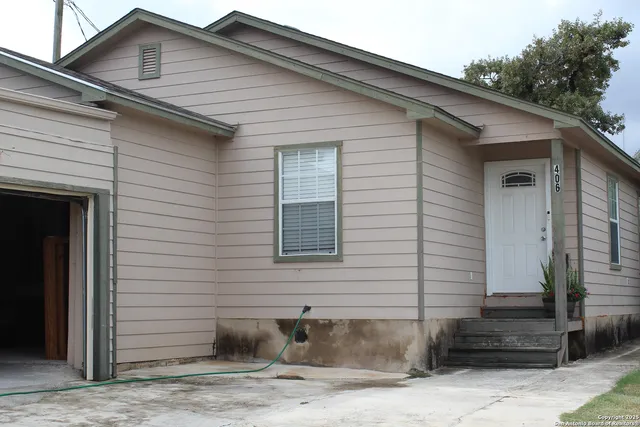 a white house with a outdoor space