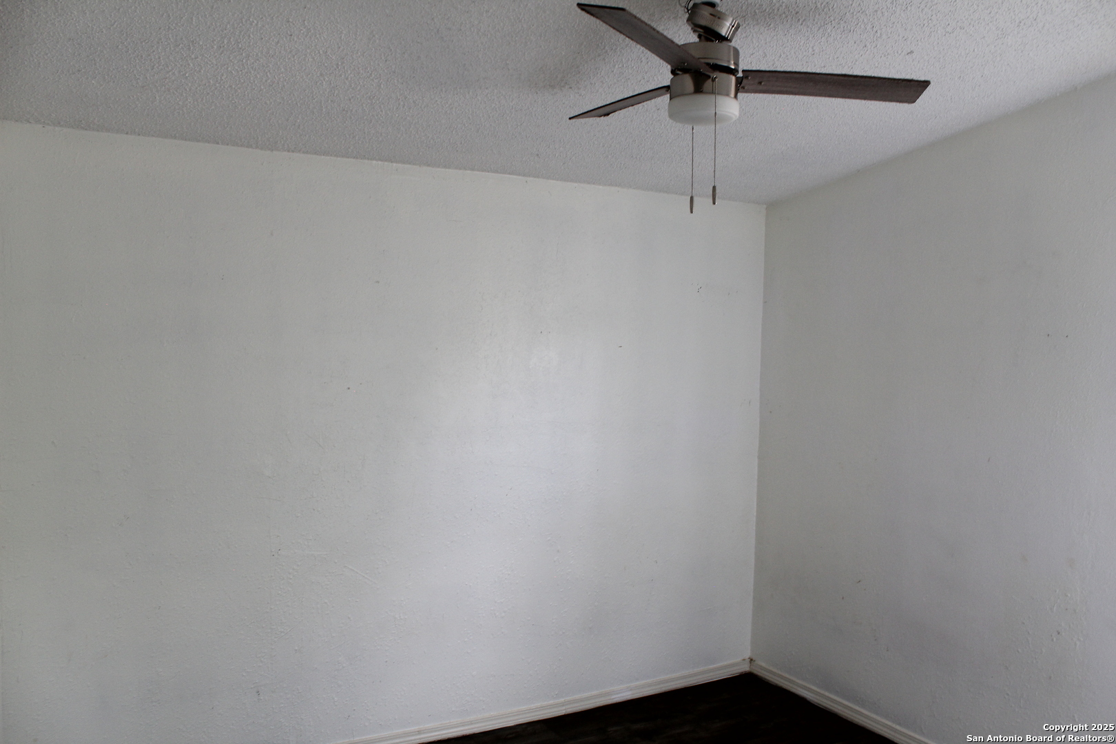 406 County Road 6850, Unit 2 Lytle, TX 78052 - Photo 11 of 15 a small space with a fan and a window