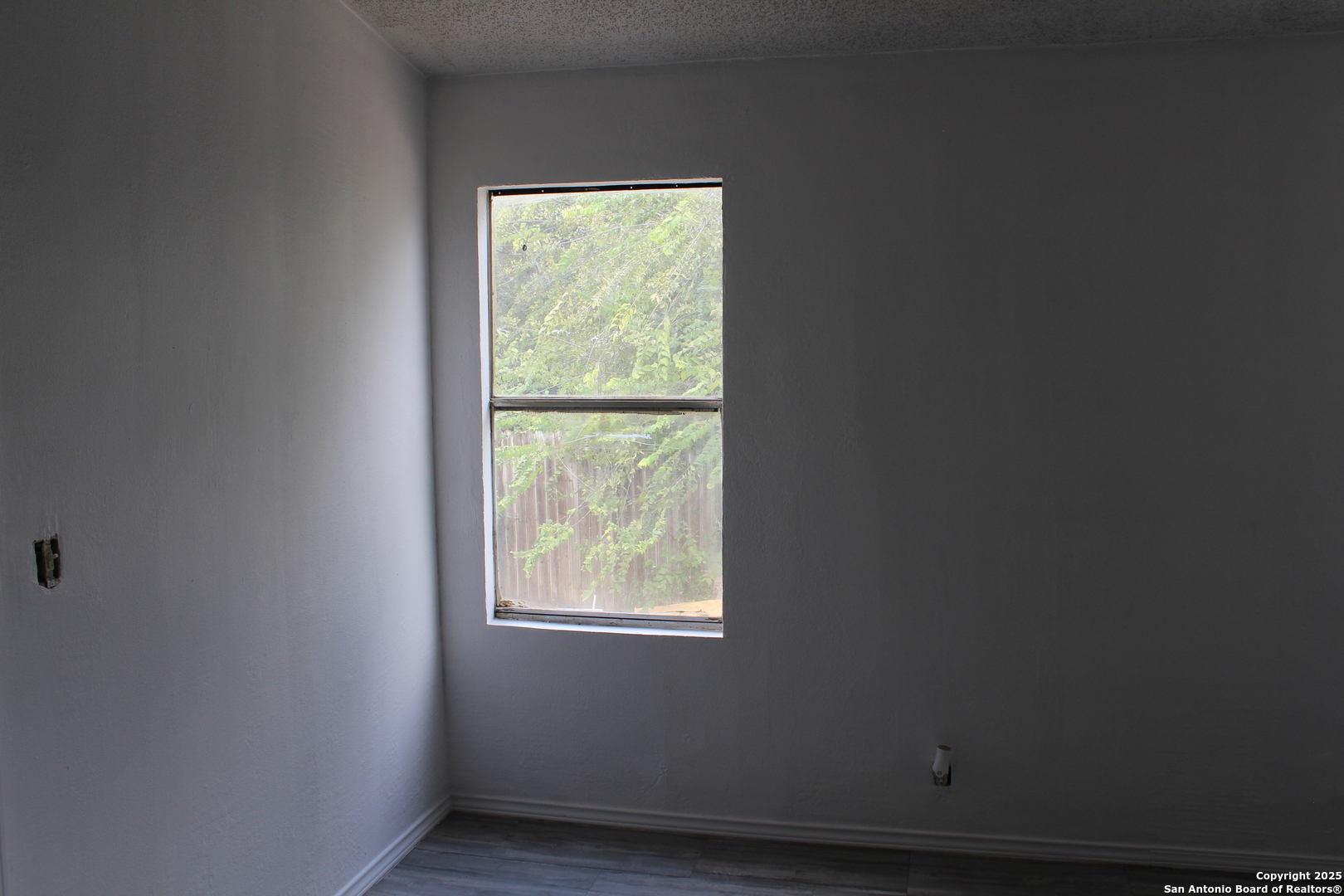 406 County Road 6850, Unit 2 Lytle, TX 78052 - Photo 14 of 15 a view of an empty room with a window