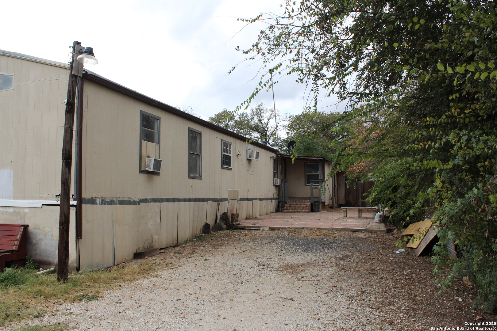 406 County Road 6850, Unit 2 Lytle, TX 78052 - Photo 3 of 15 a backyard of a house with shaded area