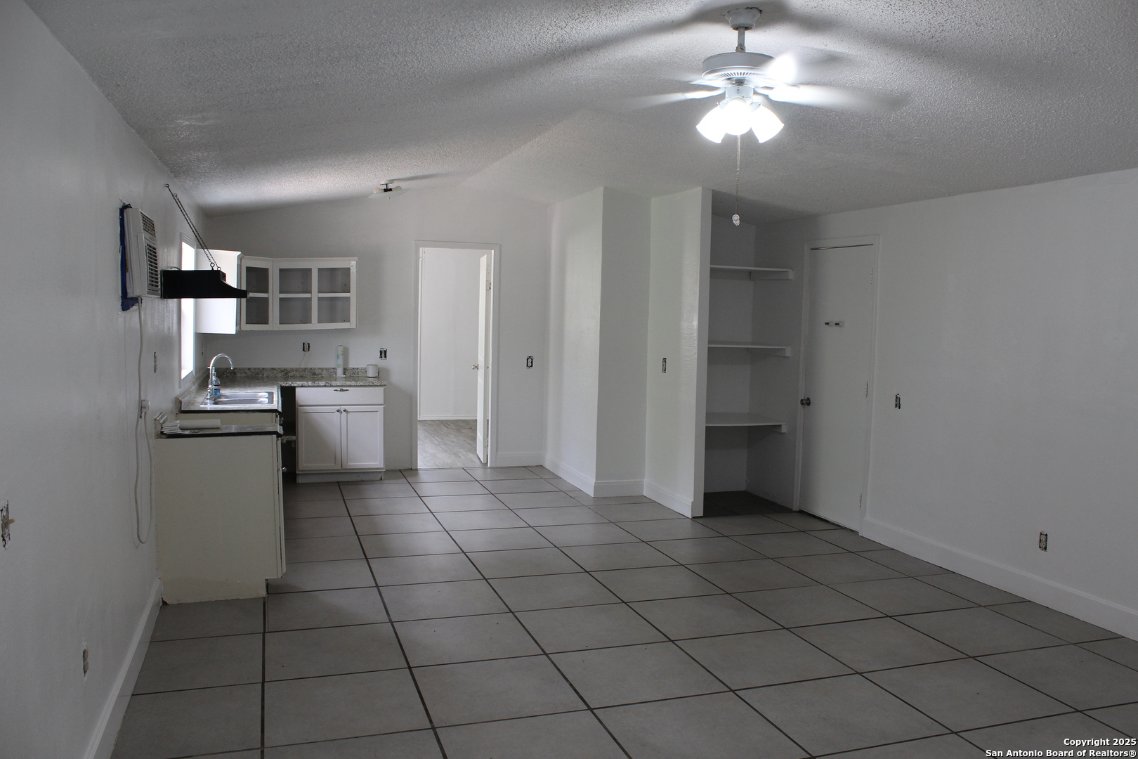 406 County Road 6850, Unit 2 Lytle, TX 78052 - Photo 7 of 15 a view of a kitchen with a sink and dishwasher kitchen view