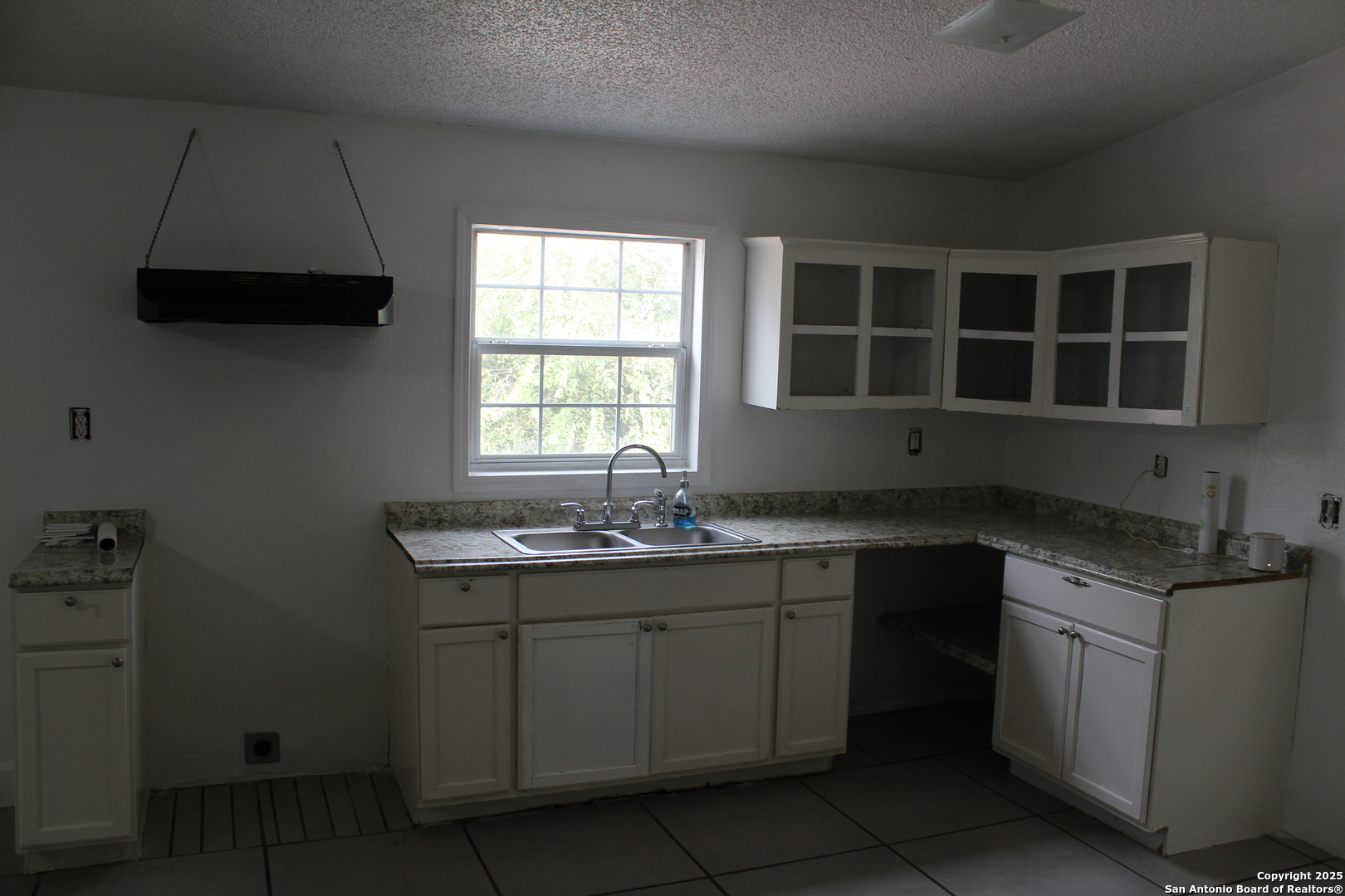 406 County Road 6850, Unit 2 Lytle, TX 78052 - Photo 8 of 15 a kitchen with a sink and cabinets
