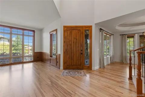 a view of a livingroom with wooden floor and closet