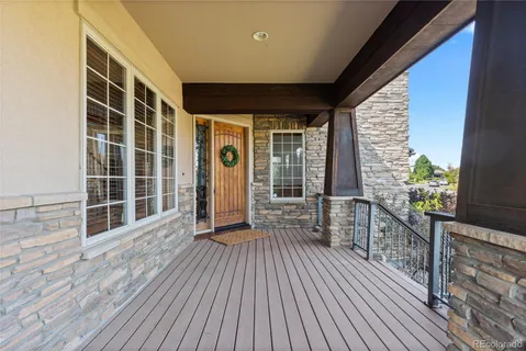 a view of a balcony with wooden floor