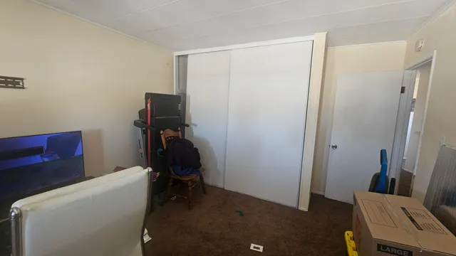 a room with furniture and gym equipment