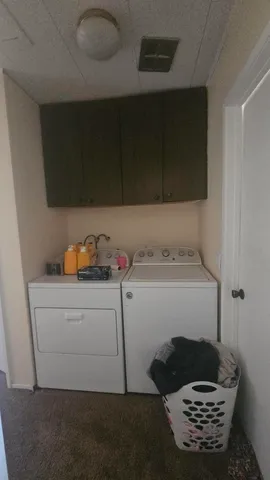 a storage room with washer and dryer